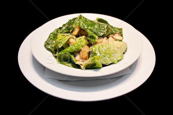 Caesar salade witte plaat geïsoleerd zwarte restaurant Stockfoto © mtoome