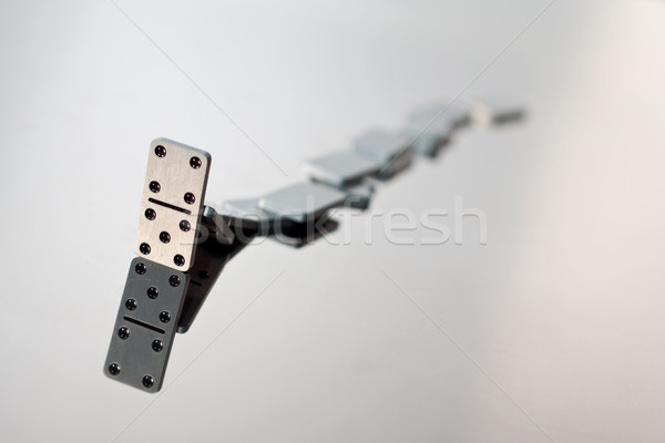A queue of falling dominoes Stock photo © mtoome