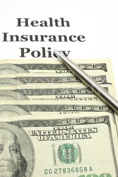 Health Insurance Policy with Hundred Bills and Pen Stock photo © mybaitshop