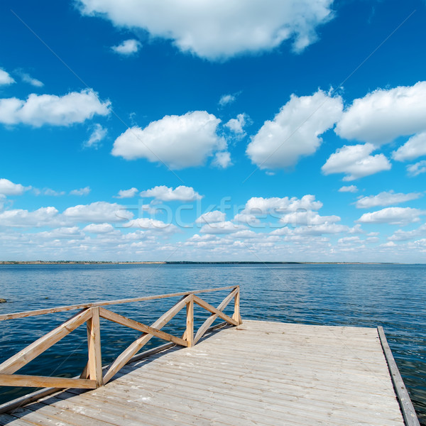 wooden floor on river and deep blue sky Stock photo © mycola