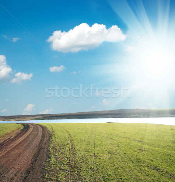 Schmutzigen Weg Horizont Sonne Wolken Gras Stock foto © mycola