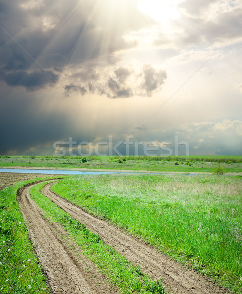 Kırsal yol yeşil ot dramatik gökyüzü su Stok fotoğraf © mycola