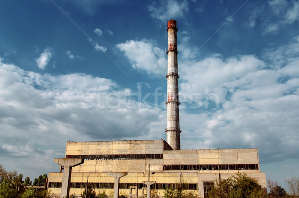 old factory smokestack tube against cloudy sky Stock photo © mycola