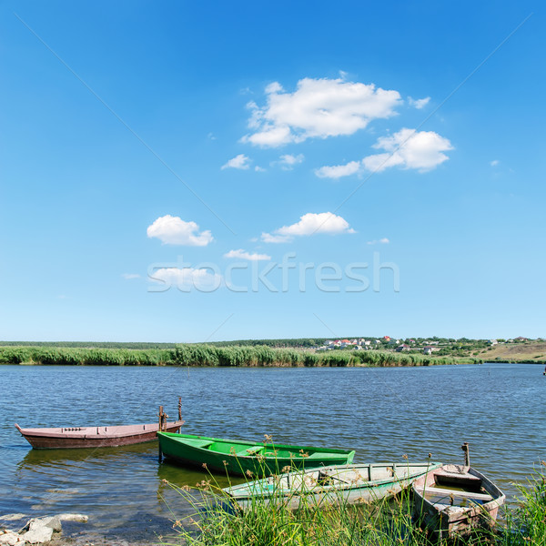 old boats on river under cloudy sky Stock photo © mycola