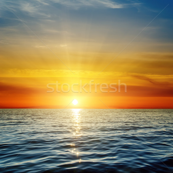 Pomarańczowy wygaśnięcia ciemne niebieski morza wody Zdjęcia stock © mycola