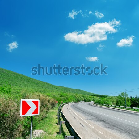 turn right sign, curved road and blue sky Stock photo © mycola