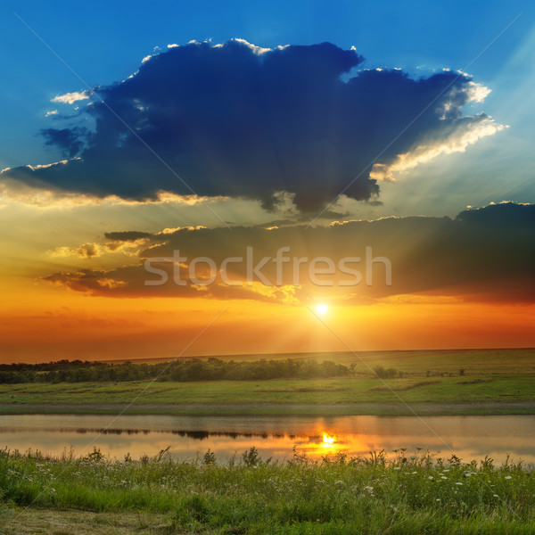 Piękna dramatyczny wygaśnięcia rzeki niebo trawy Zdjęcia stock © mycola