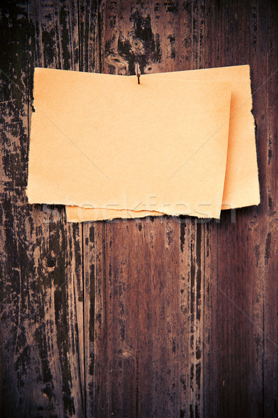 Old brown paper on wood board background Stock photo © myfh88