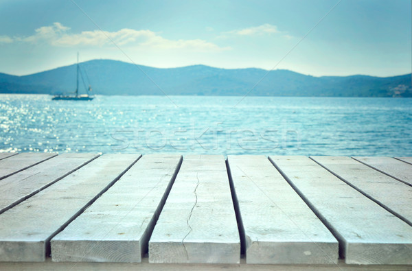 Wooden planks with sea Stock photo © mythja