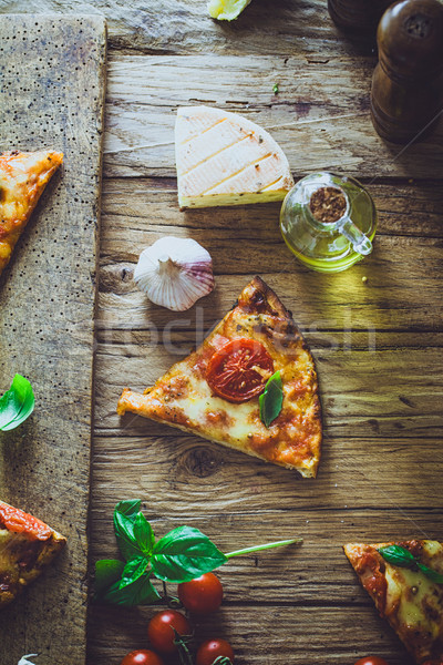 Pizza on wood with ingredients Stock photo © mythja