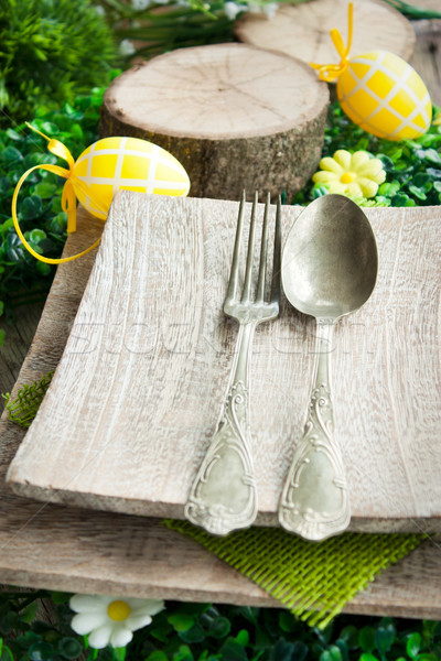 Restaurant menu series. Easter place setting. Fork and knife in rustic country table setting Stock photo © mythja