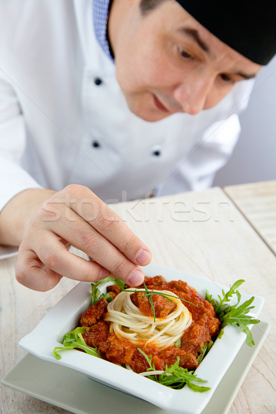 Male chef in restaurant Stock photo © mythja