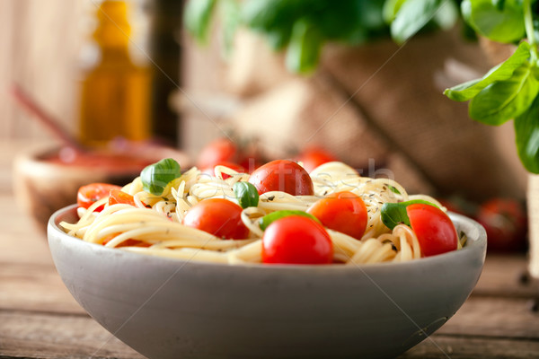 Pasta olijfolie italiaanse keuken knoflook basilicum tomaten Stockfoto © mythja