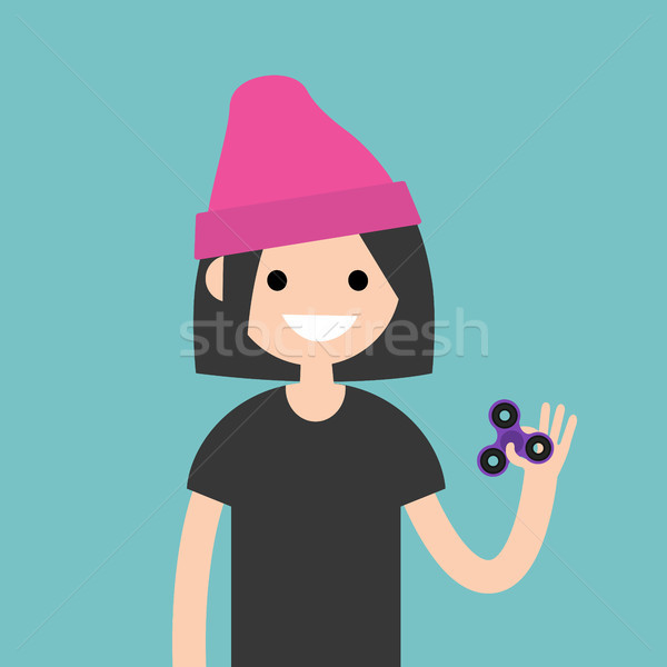 Young female character spinning a hand toy. Stress relieving toy Stock photo © nadia_snopek