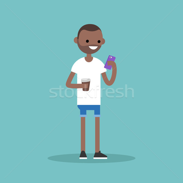 Fiatal afroamerikai férfi sms chat okostelefon tart csésze Stock fotó © nadia_snopek