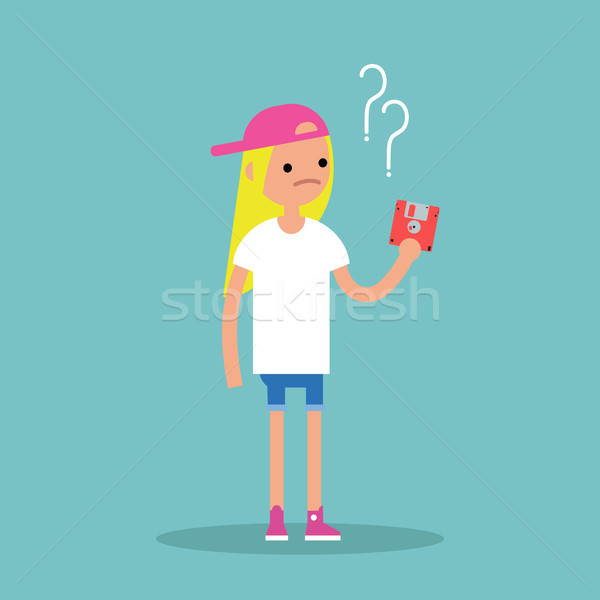 Outdated technology concept. Young blond girl has no idea what t Stock photo © nadia_snopek