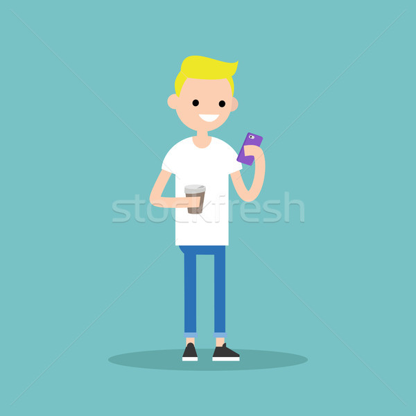 Young blond boy texting on his smartphone and holding a cup of t Stock photo © nadia_snopek
