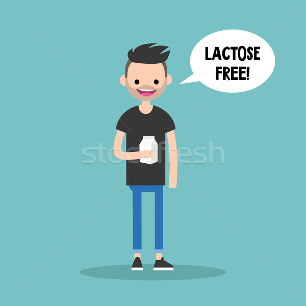 Young bearded man holding a carton of lactose free milk / flat e Stock photo © nadia_snopek