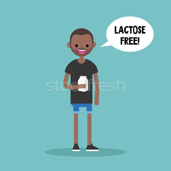 Young black man holding a carton of lactose free milk / flat edi Stock photo © nadia_snopek