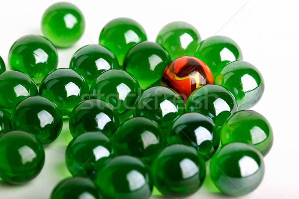 Grupy zielone szkła kulki jeden pomarańczowy Zdjęcia stock © nailiaschwarz