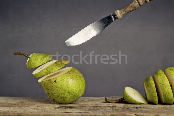 Sliced Pears and flying Knife Stock photo © nailiaschwarz