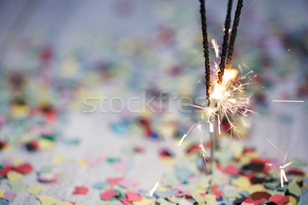 Confettis brûlant coloré table en bois fête anniversaire [[stock_photo]] © nailiaschwarz