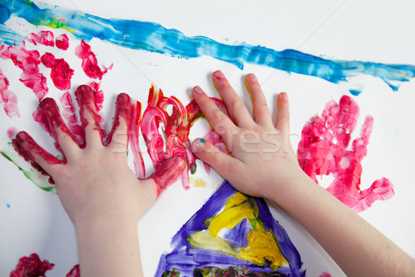 Little Children Hands doing Fingerpainting Stock photo © nailiaschwarz
