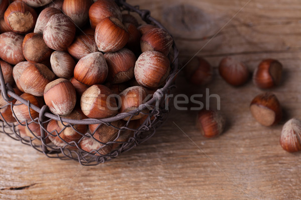 Mogyoró vasaló kosár tart sok egész Stock fotó © nailiaschwarz