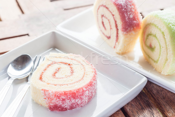 Set of colorful jam rolls with spoon and fork Stock photo © nalinratphi