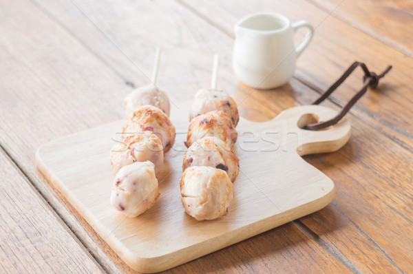 Squid grilled ball on wooden plate Stock photo © nalinratphi