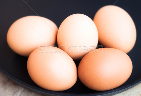 Egg group in a black tray Stock photo © nalinratphi