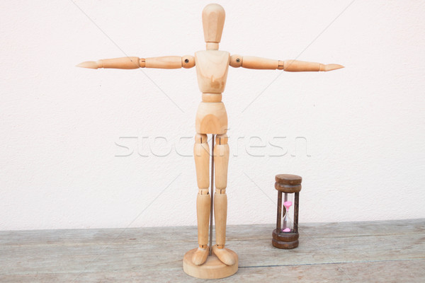 Wooden mannequin extend the arms of count down  Stock photo © nalinratphi