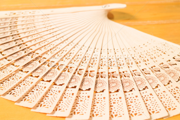Oriental carved wooden hand fan Stock photo © nalinratphi