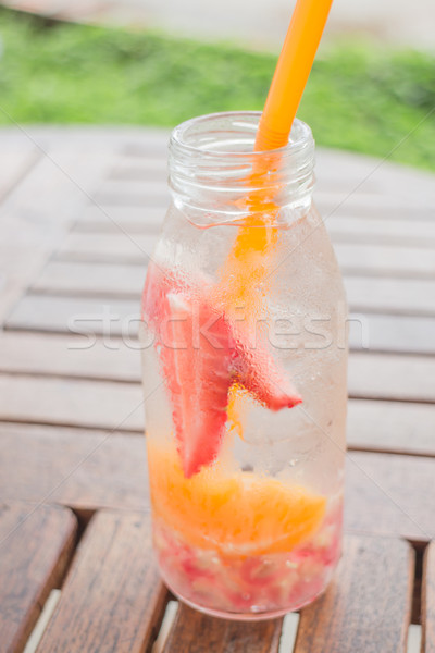 Infused water bottle of mix fruit refreshing drink Stock photo © nalinratphi