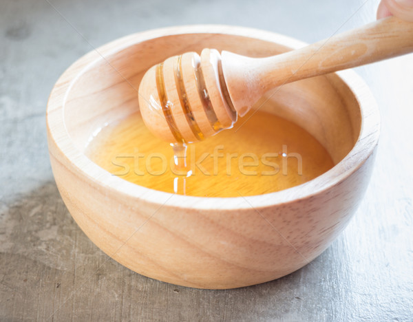 Golden honey cup and dipper Stock photo © nalinratphi