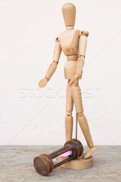 Wood mannequin and hourglass to represent unfortunately time Stock photo © nalinratphi