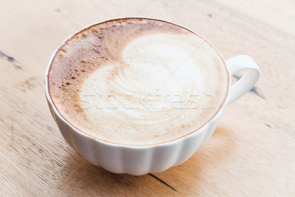 Free pour hot coffee latte art cup on wood background Stock photo © nalinratphi