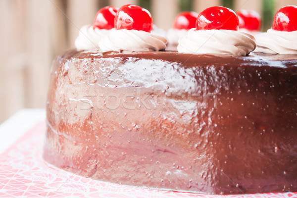 Delicious chocolate cake with cherry on top Stock photo © nalinratphi