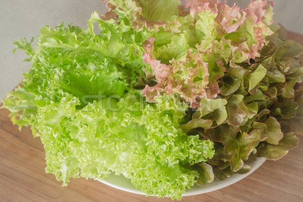 Fresh salad vegetable on wooden background Stock photo © nalinratphi