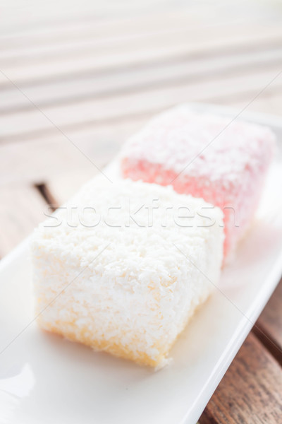 Pink and white lamington cakes on wood table Stock photo © nalinratphi