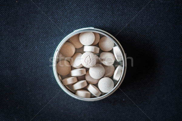 Stock photo: Natural vitamin pills in package on dark background 