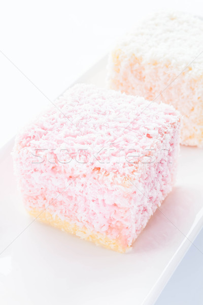 Lamington sponge cakes on white plate Stock photo © nalinratphi