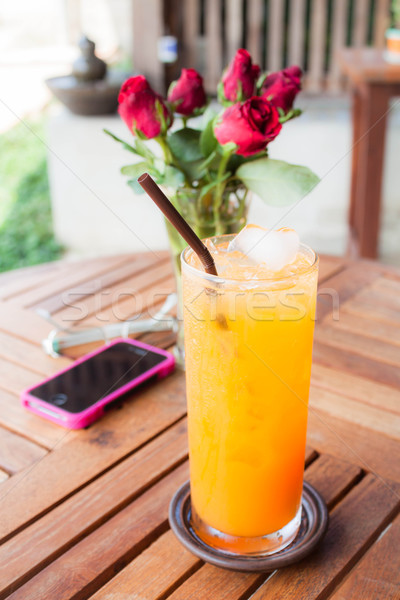 Relaxing time with fresh iced orange juice  Stock photo © nalinratphi