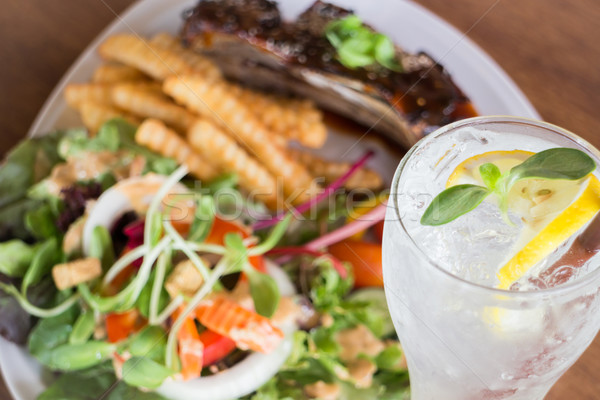 Delicious barbecued ribs and lemon soda drink Stock photo © nalinratphi