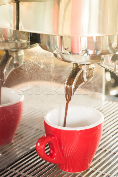 Fresh brewing hot coffee from espresso machine with vintage filt Stock photo © nalinratphi