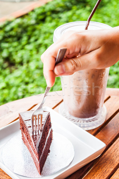 Soft chocolate cake and iced coffee serving on table Stock photo © nalinratphi