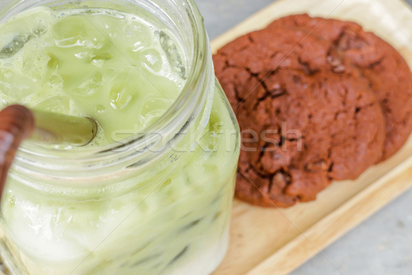 Iced green tea latte and chocolate cookies Stock photo © nalinratphi