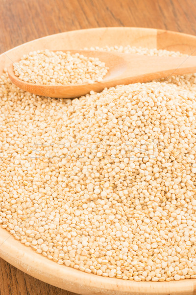 Stock photo: Quinoa grain in wooden plate