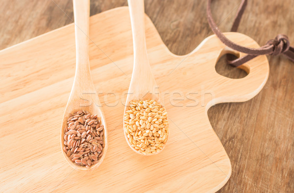 Spoon of flax seed on wooden table  Stock photo © nalinratphi