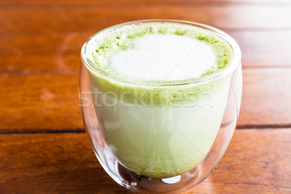 Hot matcha green tea latte glass with milk microfoam Stock photo © nalinratphi